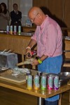 Zimmern blowtorching a geoduck clam.